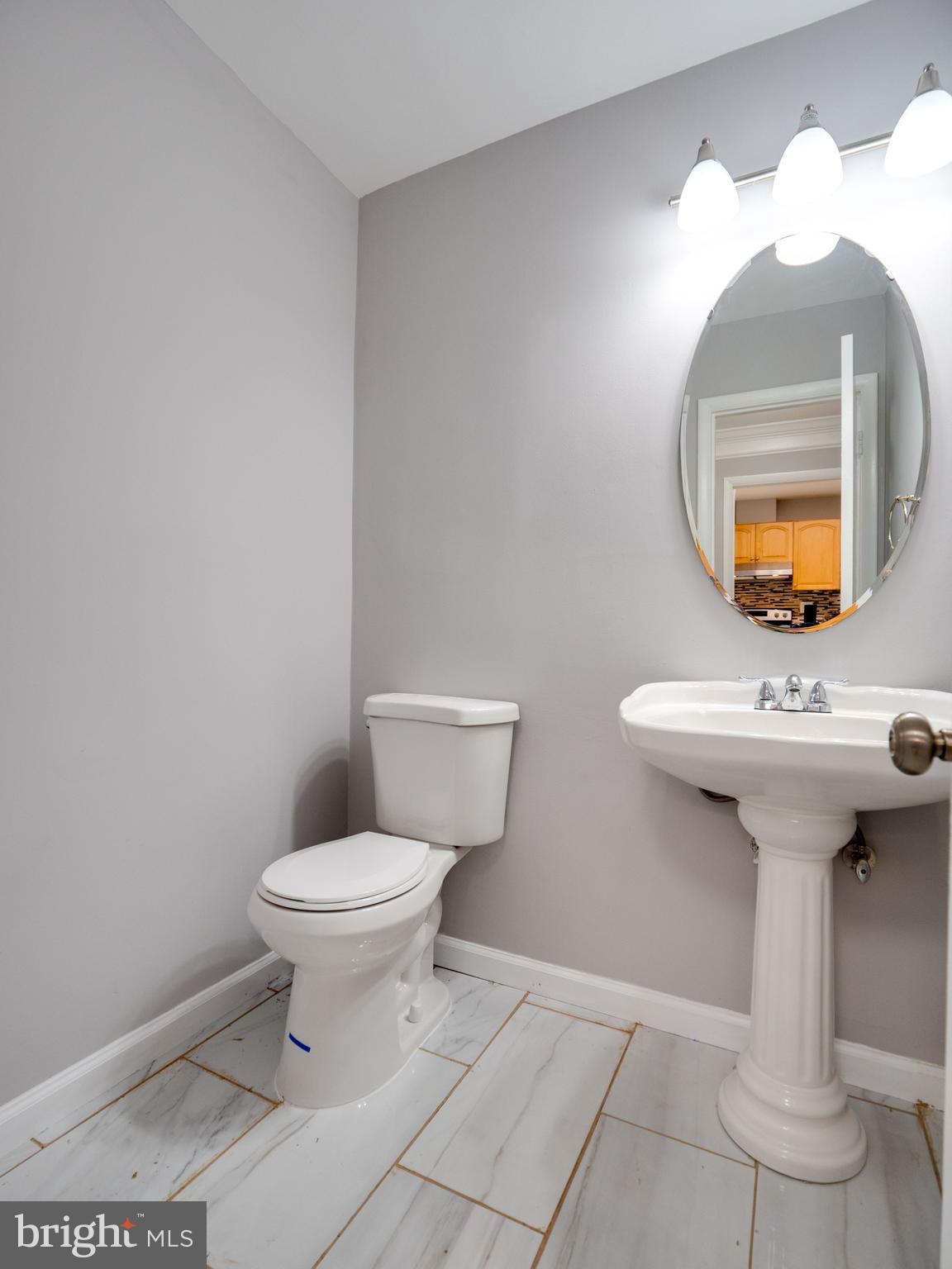 11963 Barrel Cooper Court Reston, VA 20191 - Photo 14 of 33 a bathroom with a toilet sink and mirror