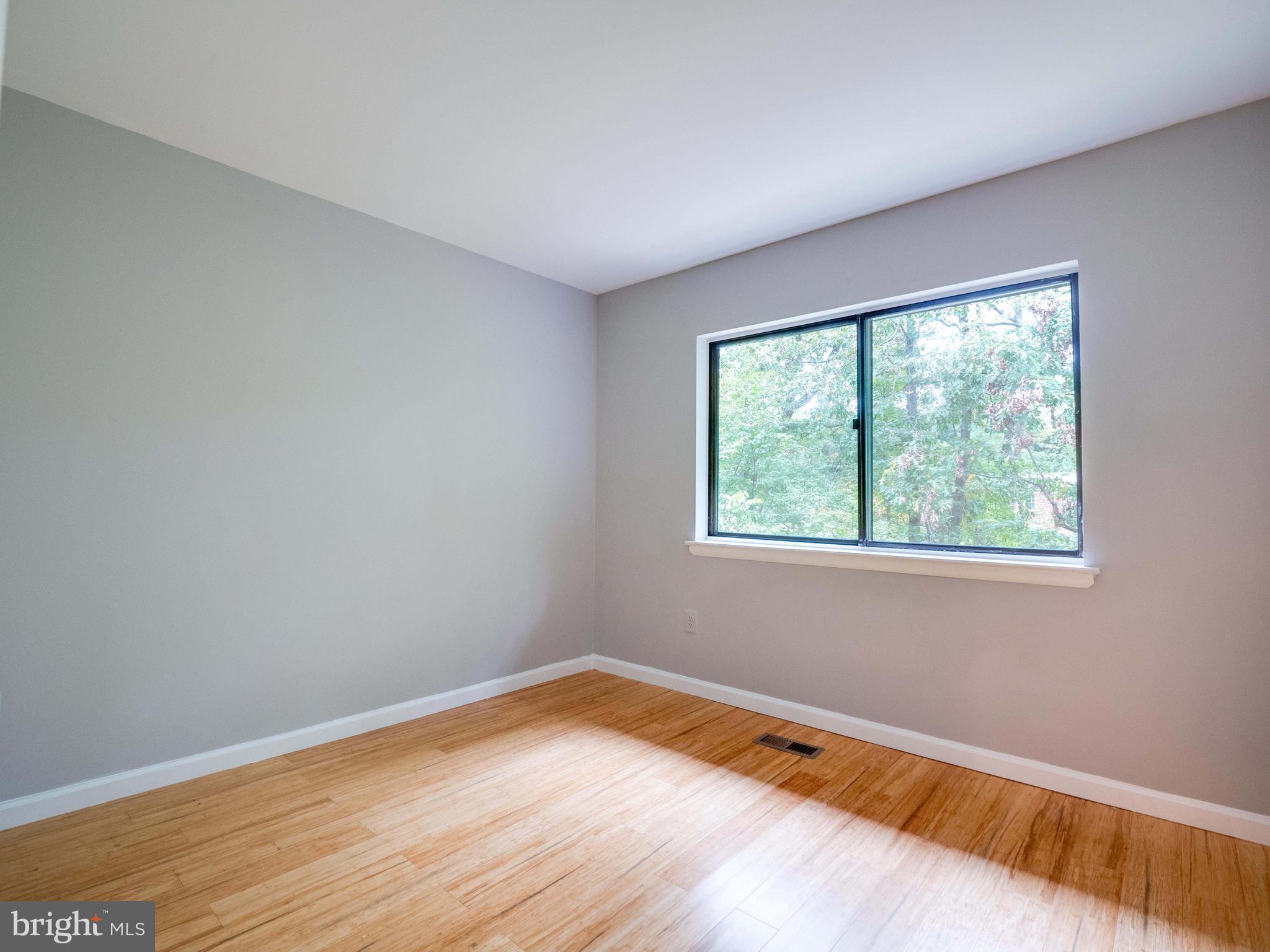 11963 Barrel Cooper Court Reston, VA 20191 - Photo 16 of 33 a view of empty room with wooden floor and fan