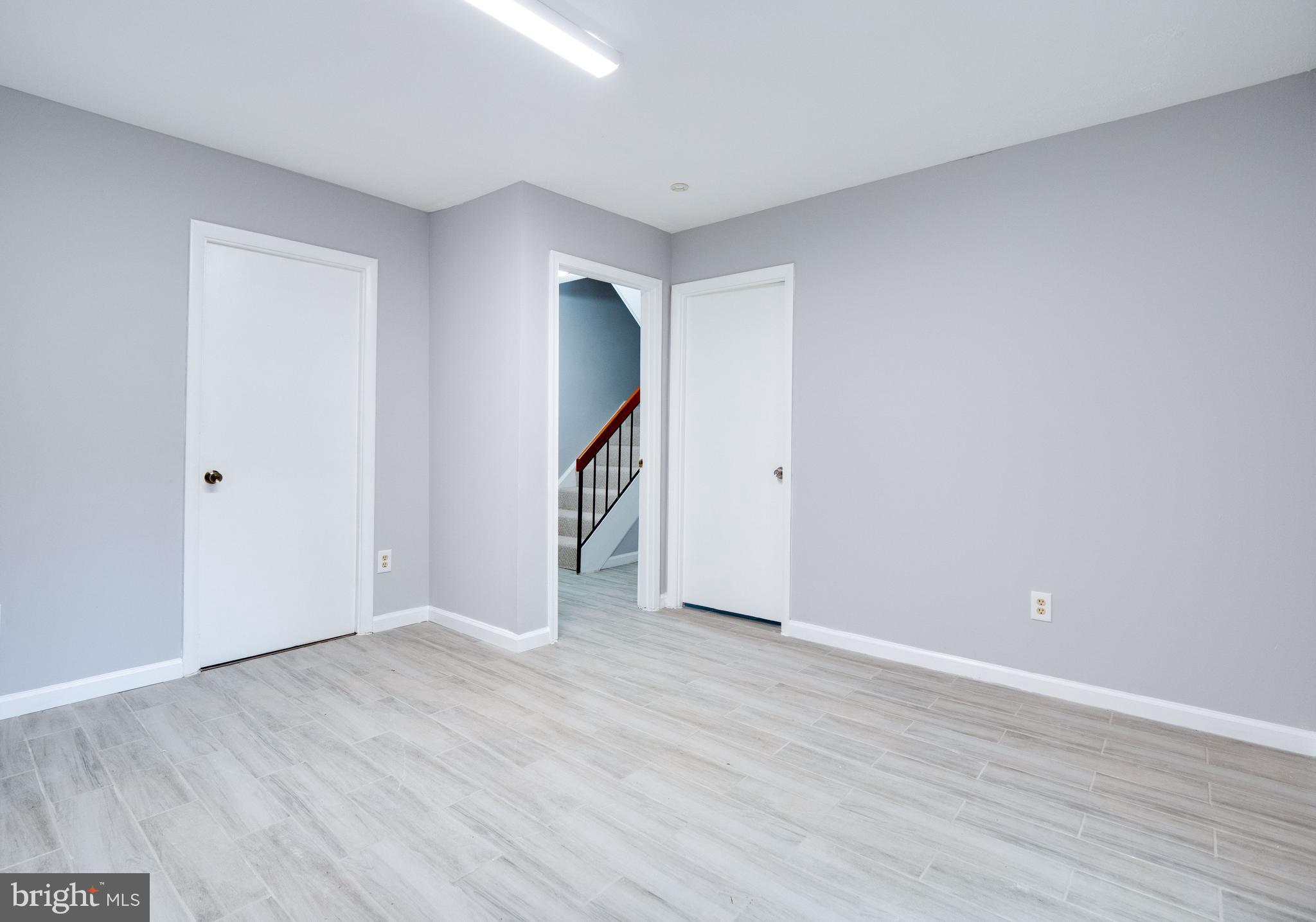 11963 Barrel Cooper Court Reston, VA 20191 - Photo 20 of 33 a view of an empty room with wooden floor