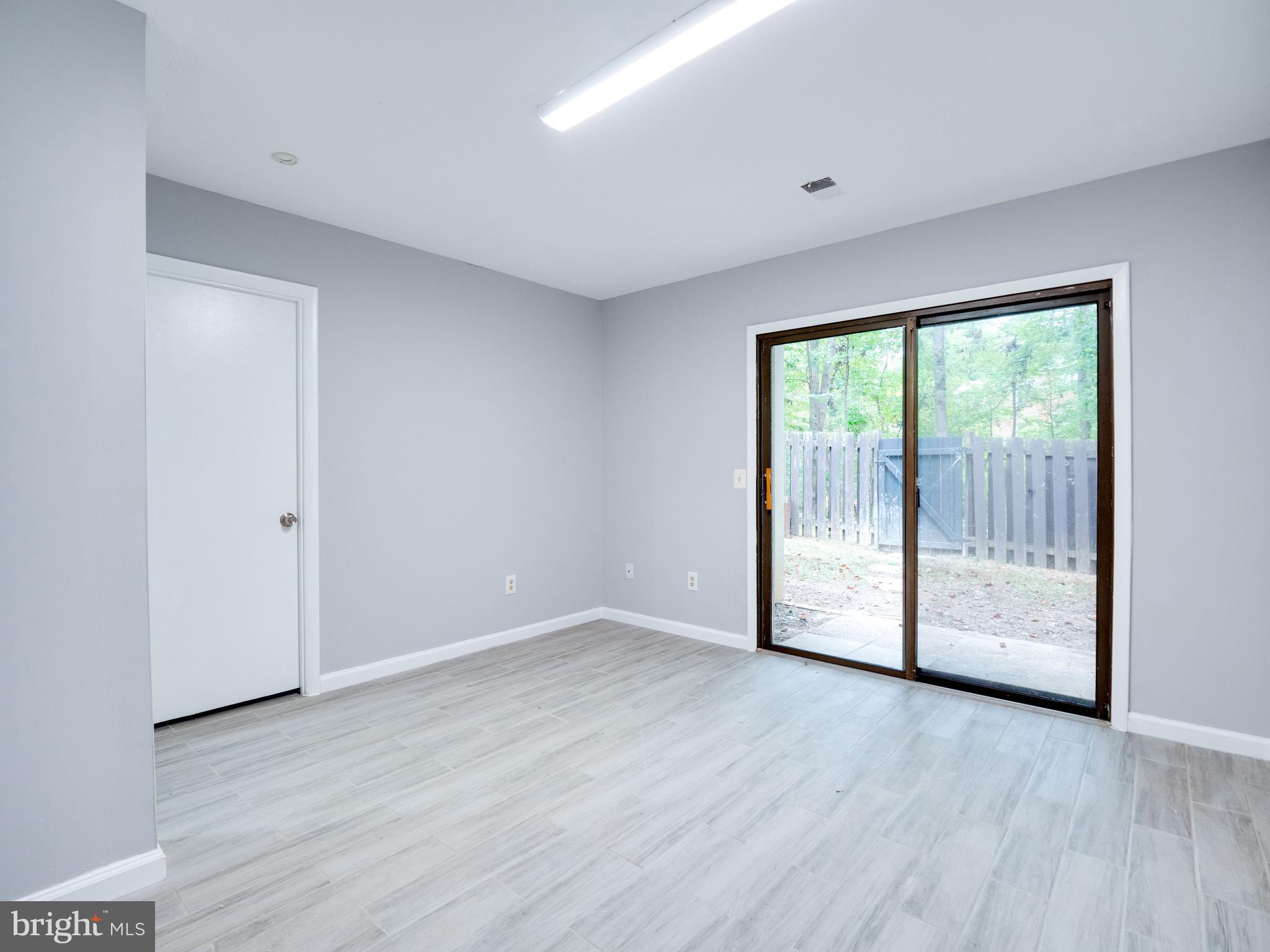 11963 Barrel Cooper Court Reston, VA 20191 - Photo 21 of 33 a view of empty room with wooden floor and fan