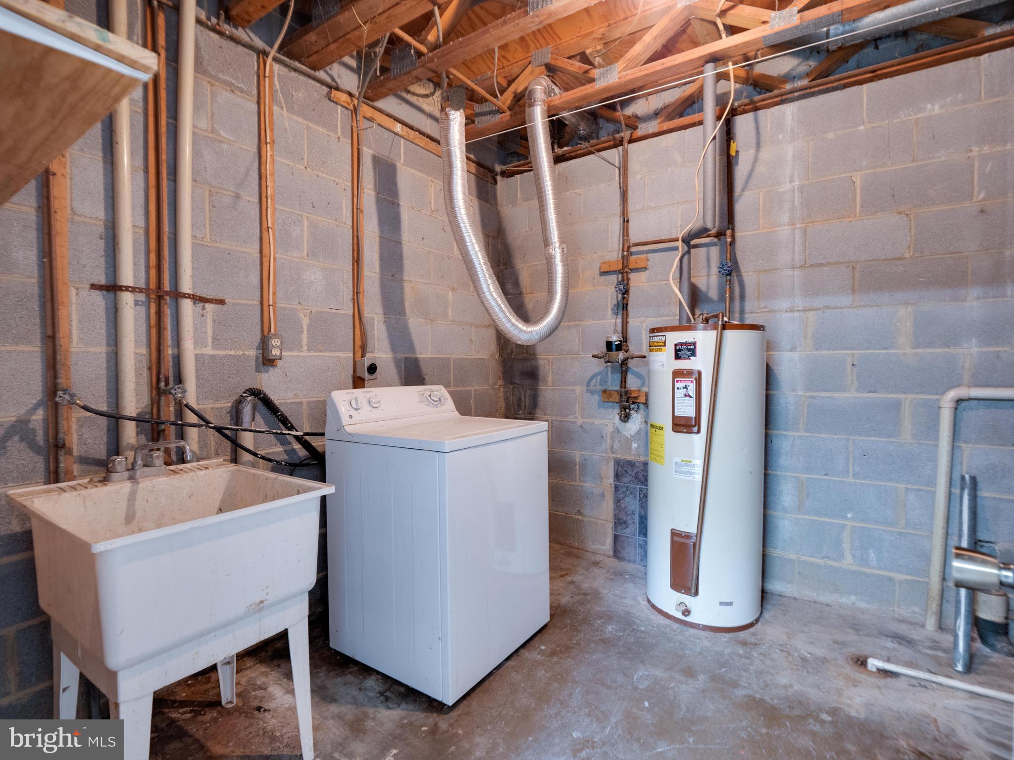 11963 Barrel Cooper Court Reston, VA 20191 - Photo 25 of 33 a room with water heater and a sink