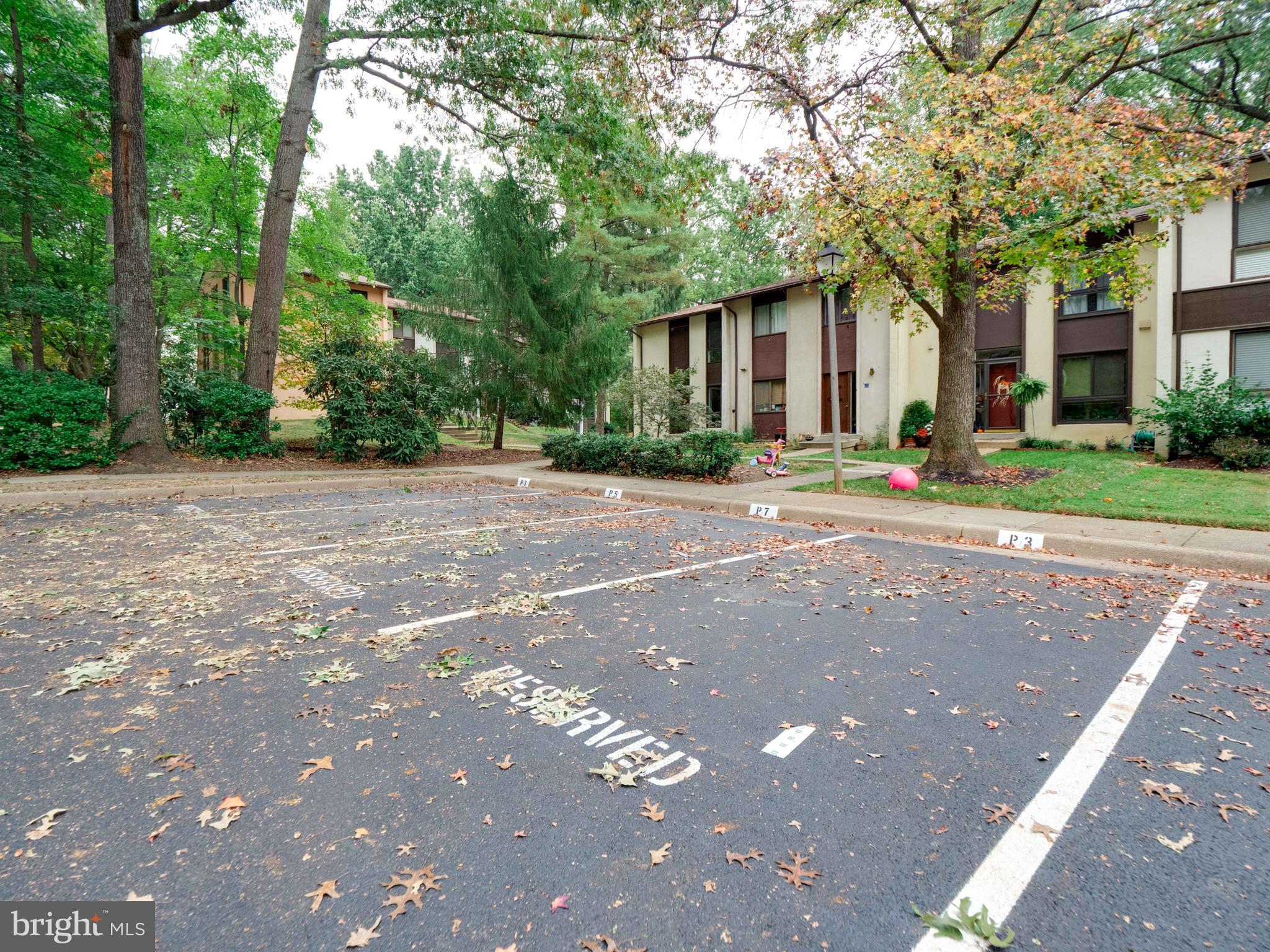 11963 Barrel Cooper Court Reston, VA 20191 - Photo 29 of 33 a front view of a house with a yard and a large tree