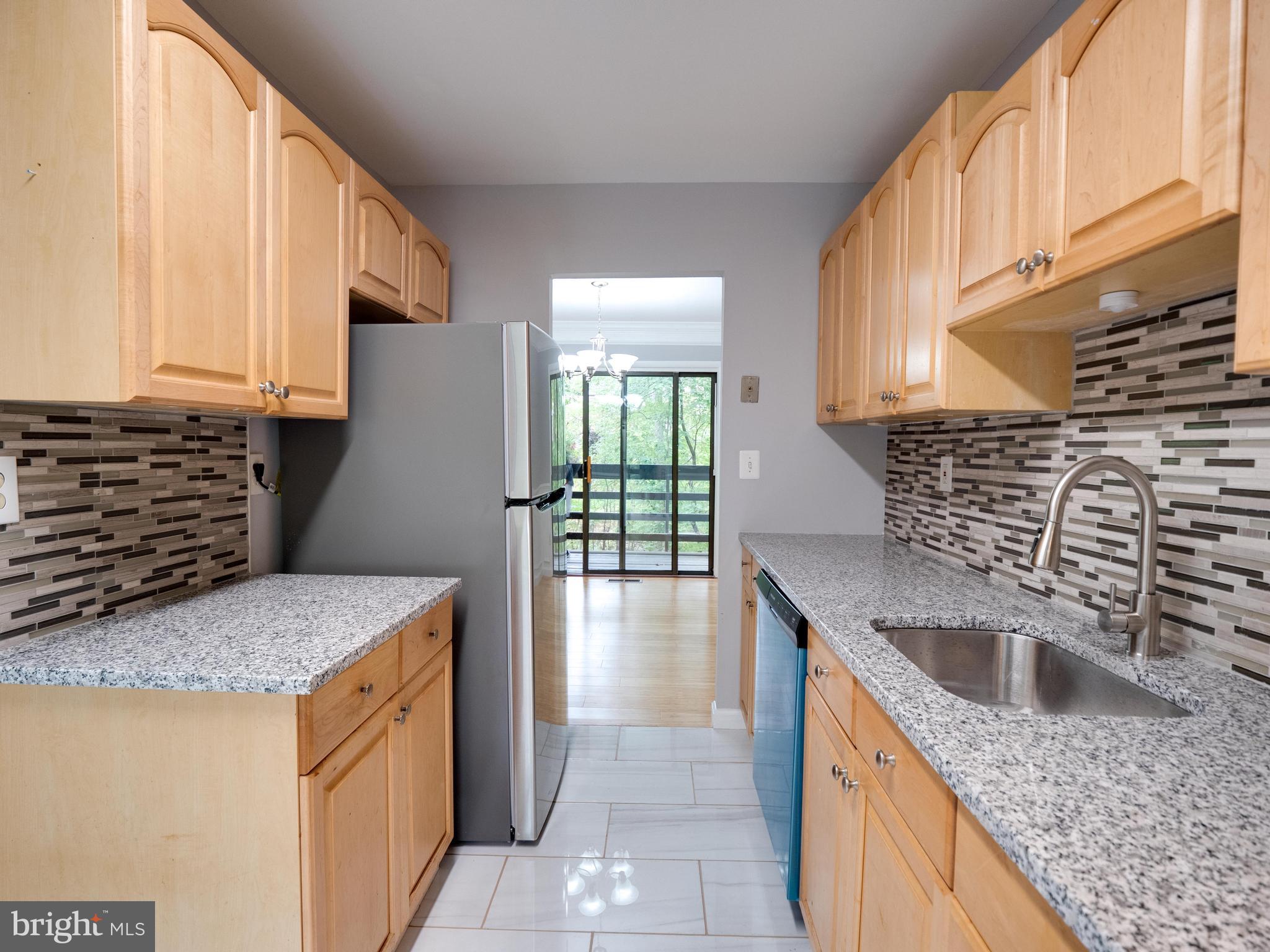 11963 Barrel Cooper Court Reston, VA 20191 - Photo 6 of 33 a kitchen with a sink stove and cabinets
