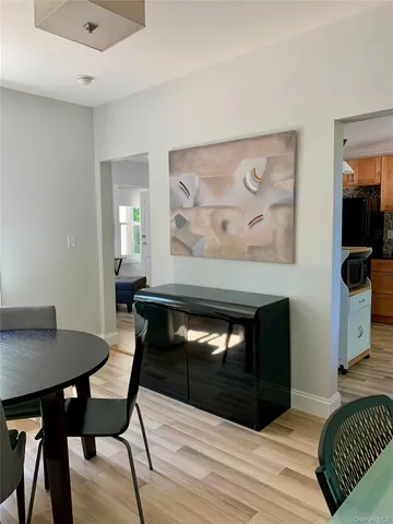 a view of a livingroom with furniture and wooden floor