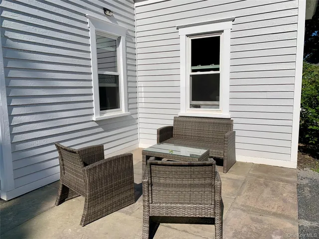 a view of a chairs and table in the back