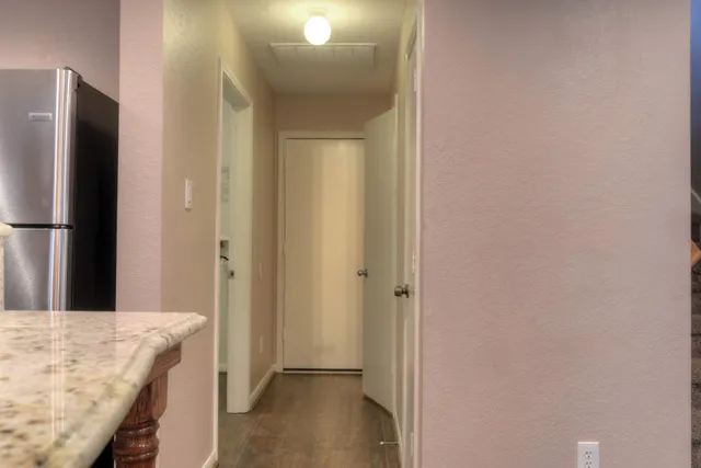 a view of a kitchen from the hallway