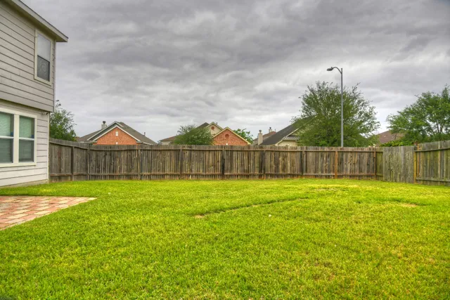 a view of an house with backyard and outdoor space