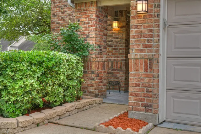 a brick building with a yard