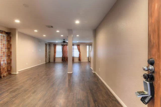 a view of gallery with wooden floor