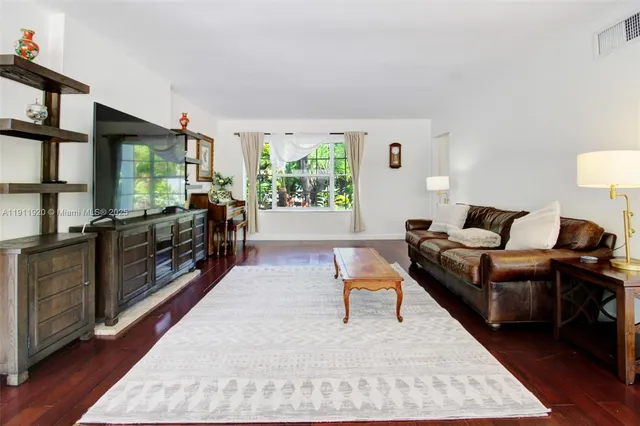 a bathroom with a sink toilet a mirror and shower