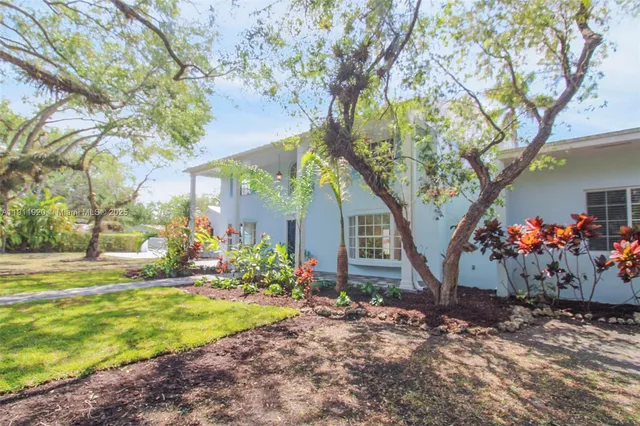 a view of a house with garden