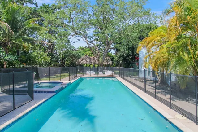 a view of a swimming pool with a patio