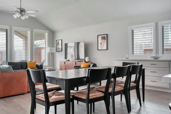 a view of a dining room with furniture and window