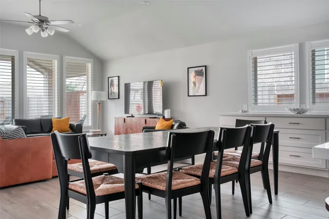 a view of a dining room with furniture and window
