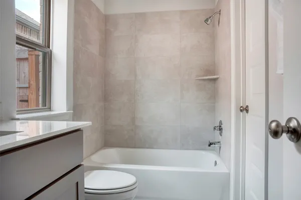 a bathroom with a sink toilet and bathtub