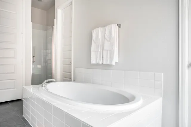 a white bath tub sitting in a bathroom