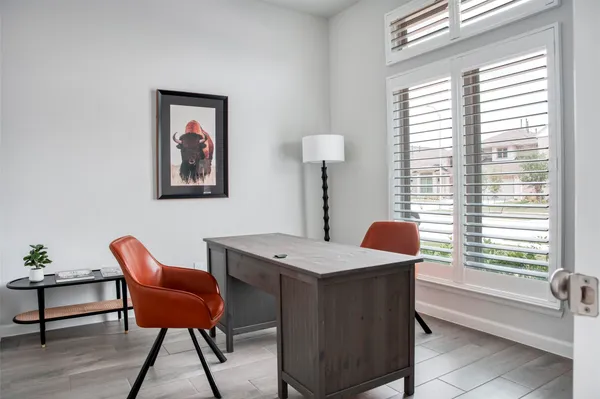 a dining room with a table and chairs