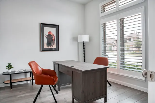 a dining room with a table and chairs