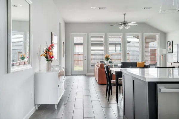a very nice looking dining room with a large window