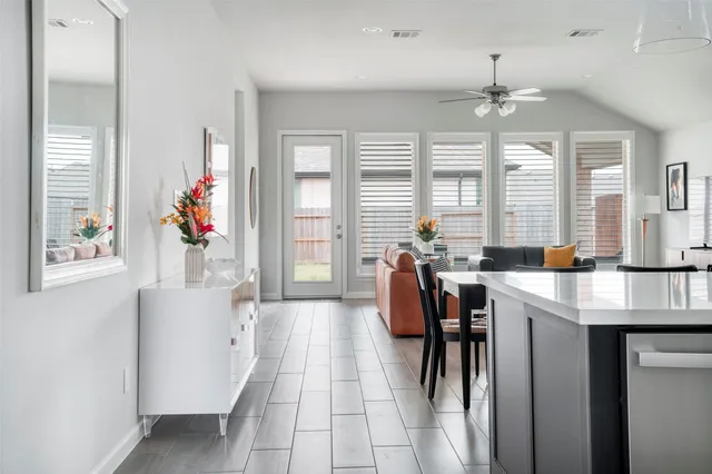 a very nice looking dining room with a large window