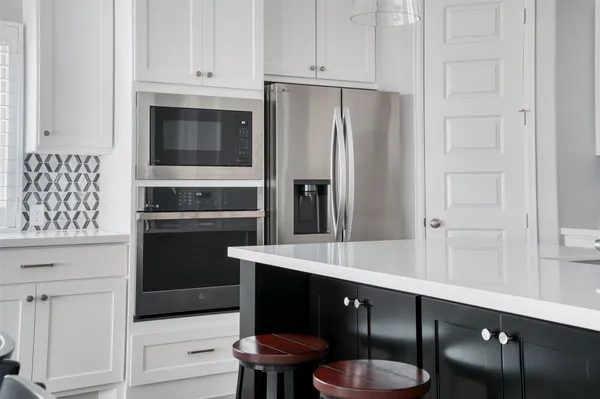 a kitchen with stainless steel appliances a refrigerator and stove