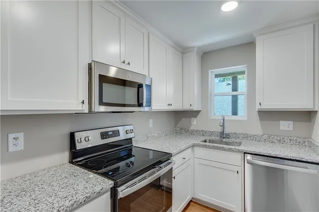 a kitchen with a stove and a microwave