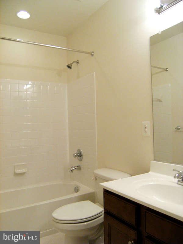 13333 Redspire Drive Silver Spring, MD 20906 - Photo 15 of 30 a bathroom with a sink a toilet and shower