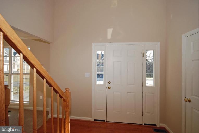 5970 Florey Road Hanover, MD 21076 - Photo 5 of 30 a view of an entryway with wooden floor