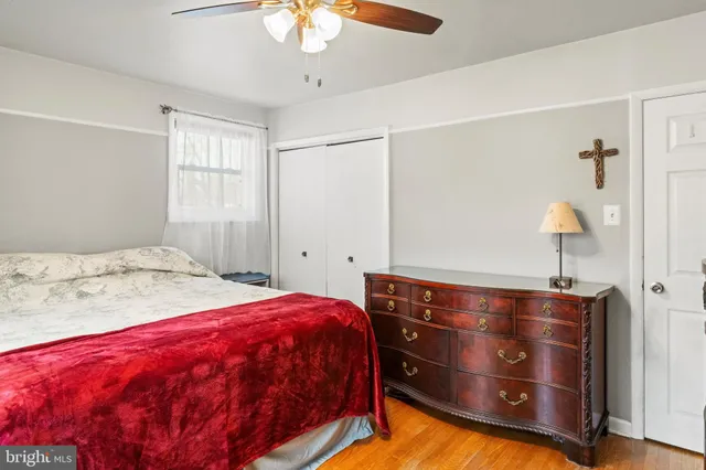 a bedroom with a bed and a dresser