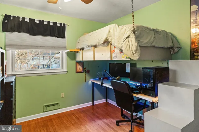a workspace with furniture hardwood and a kitchen