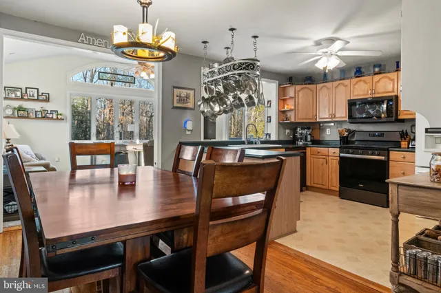 a kitchen with a dining table and chairs