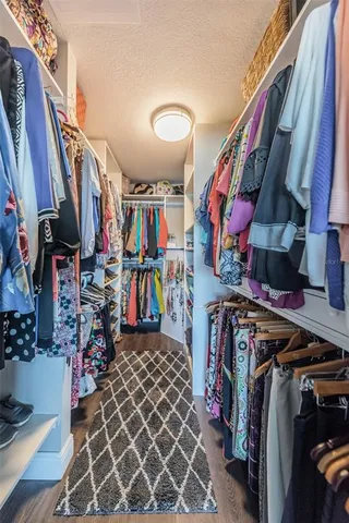 a view of a chairs and table in backyard of the house