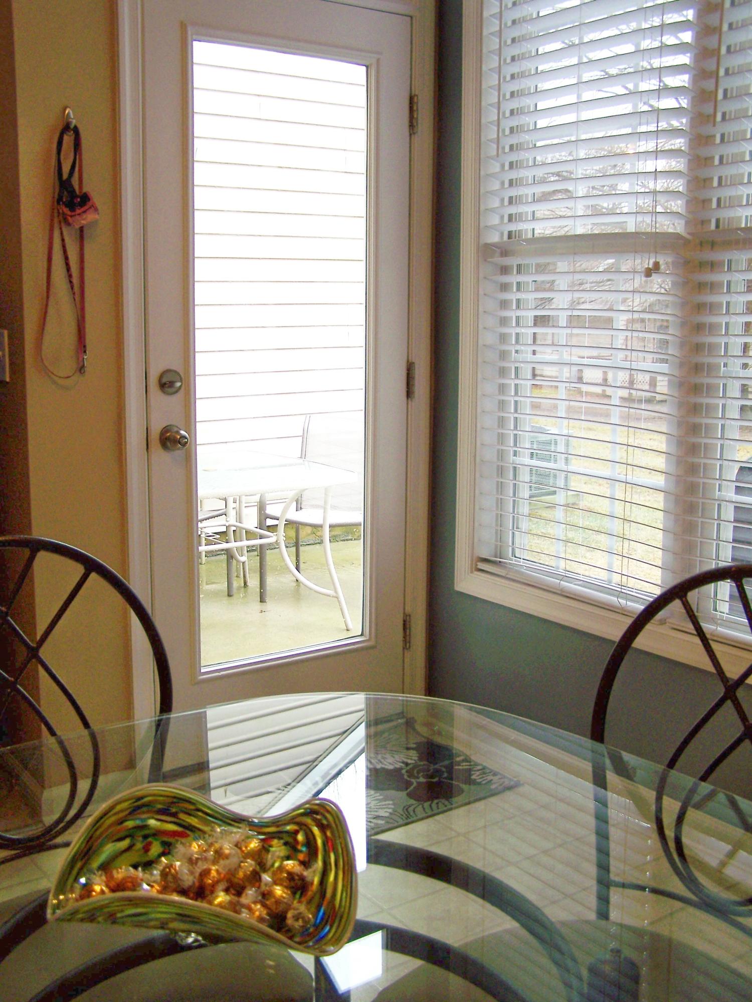 Backdoor to Patio & Storage Room