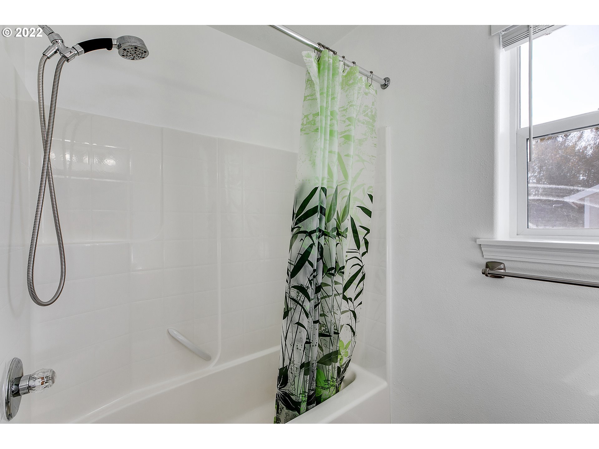 517 Northeast Mariners Loop Portland, OR 97211 - Photo 17 of 30 a bathroom with a shower and a window