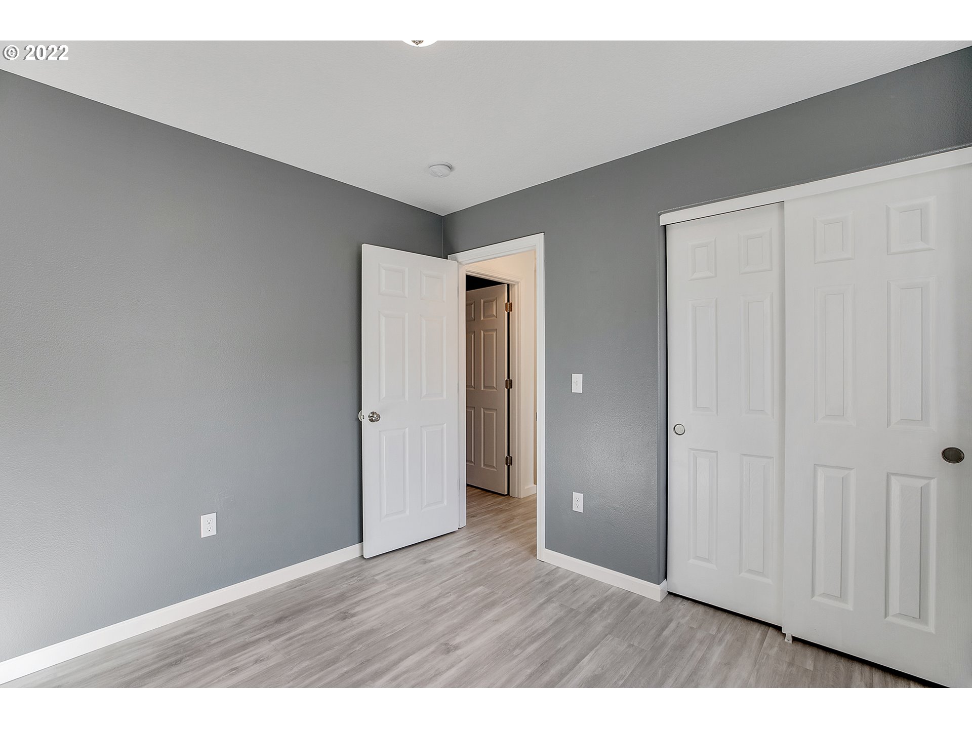 517 Northeast Mariners Loop Portland, OR 97211 - Photo 22 of 30 a view of an empty room with wooden floor