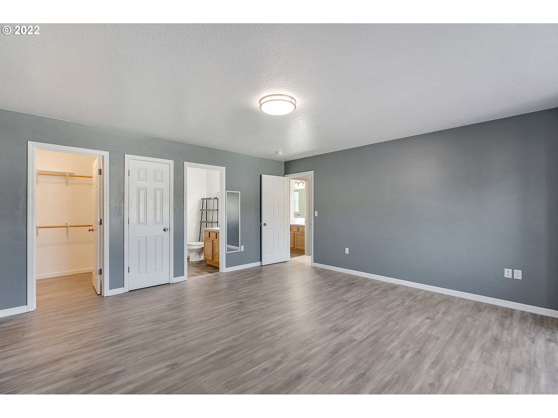 517 Northeast Mariners Loop Portland, OR 97211 - Photo 25 of 30 a view of an empty room with wooden floor