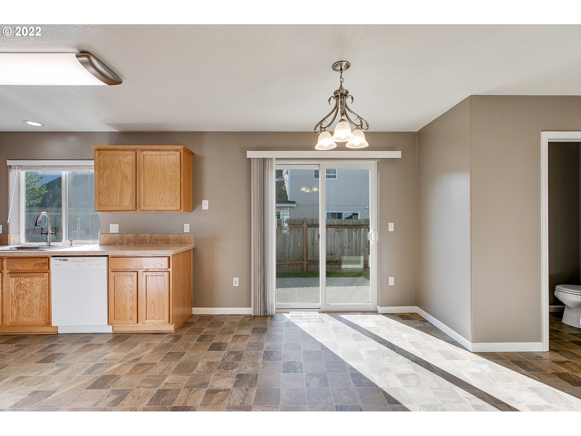 517 Northeast Mariners Loop Portland, OR 97211 - Photo 6 of 30 a view of an empty room with window and kitchen view