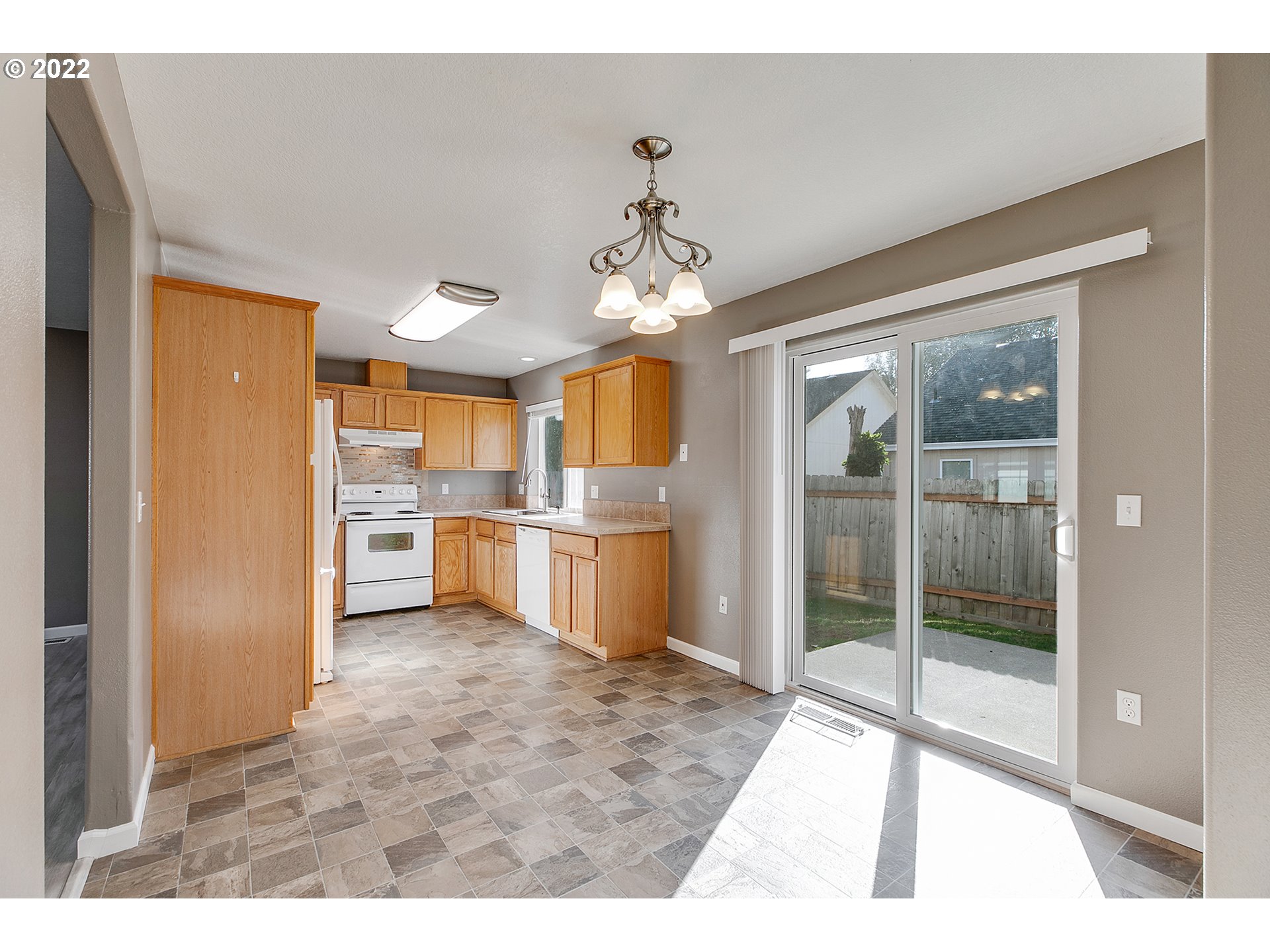 517 Northeast Mariners Loop Portland, OR 97211 - Photo 9 of 30 a open kitchen with a sink refrigerator and window