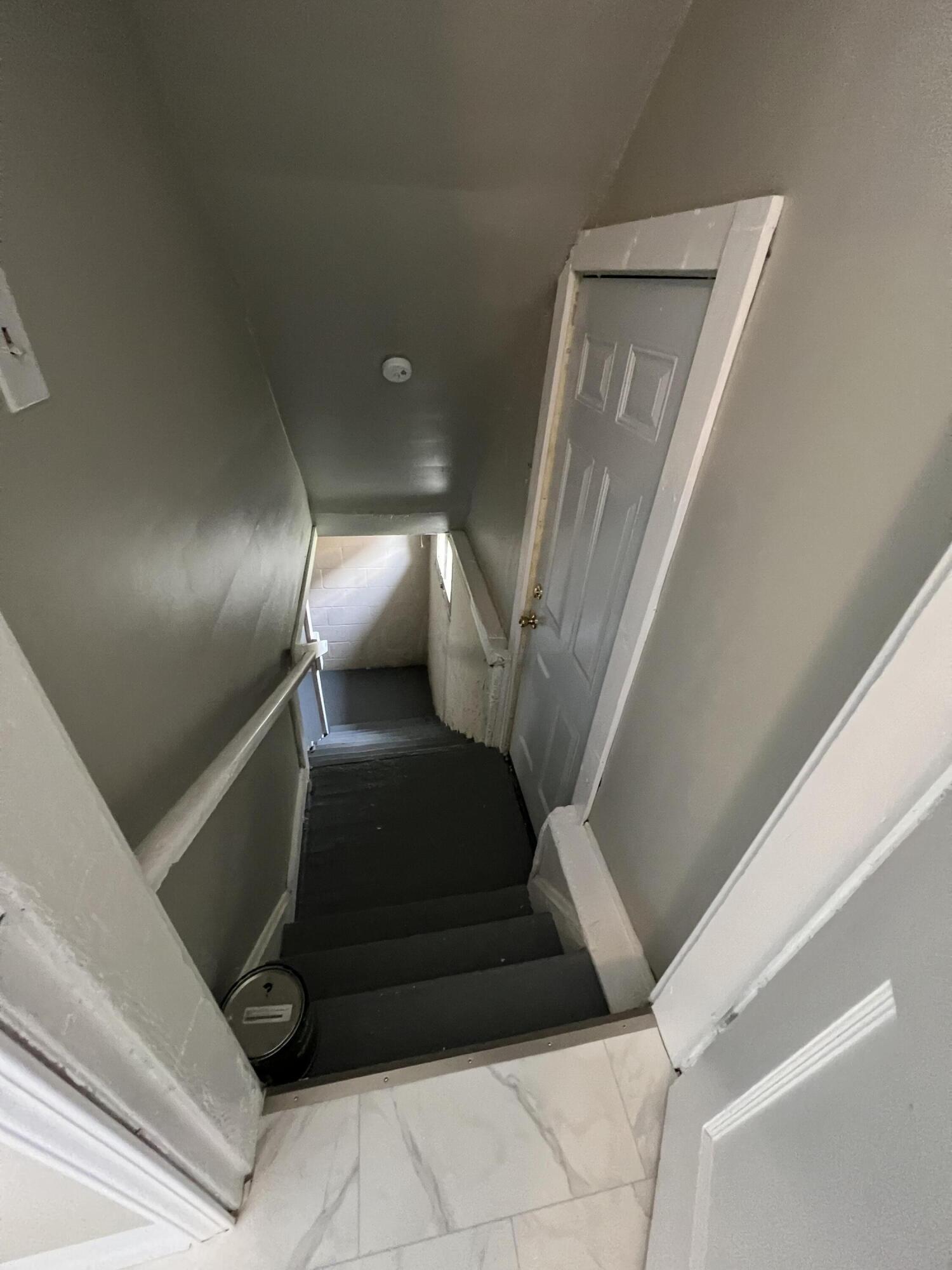 2570 Lockbourne Road Columbus, OH 43207 - Photo 21 of 25 Stairway to basement and exterior entrance door