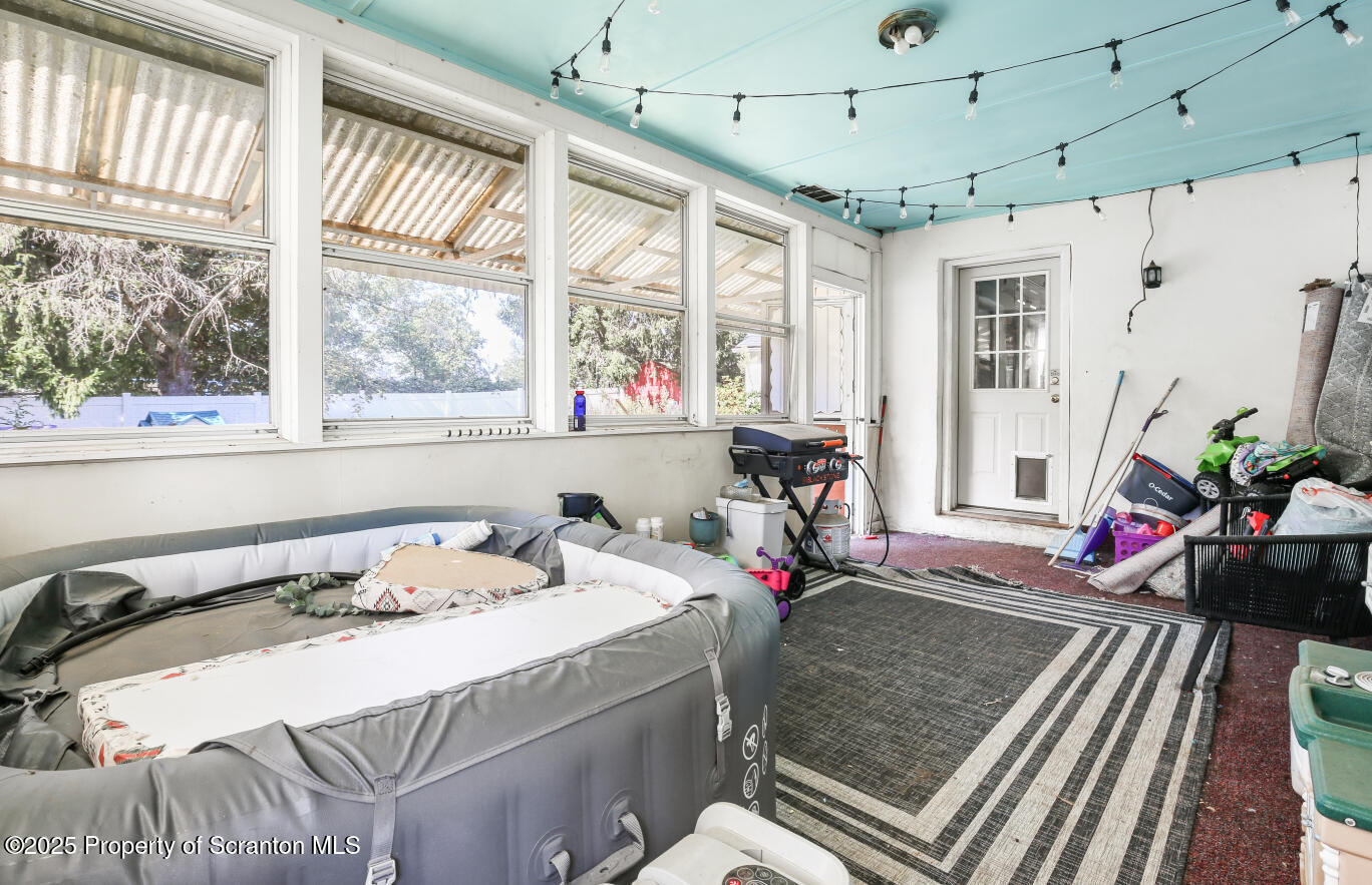 7840 Blue Ridge Trail Mountain Top, PA 18707 - Photo 11 of 20 a bedroom with a bed and a chandelier