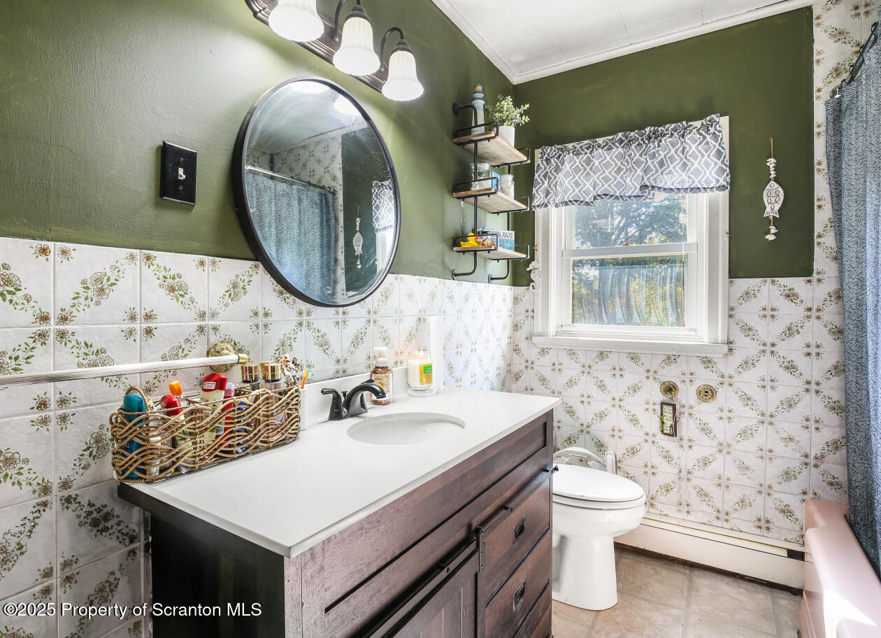 7840 Blue Ridge Trail Mountain Top, PA 18707 - Photo 16 of 20 a bathroom with a sink mirror and toilet
