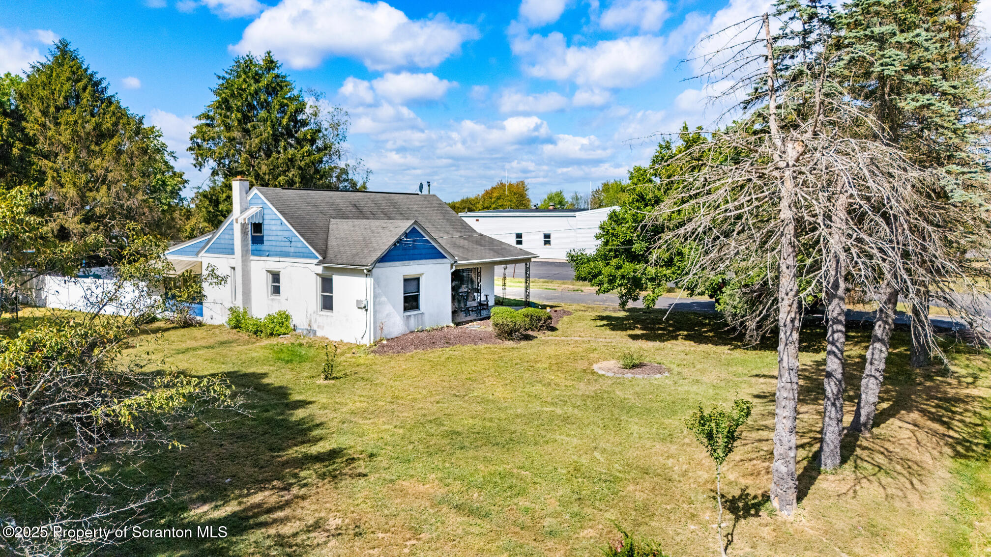 7840 Blue Ridge Trail Mountain Top, PA 18707 - Photo 4 of 20 a view of a house with a big yard plants and large trees