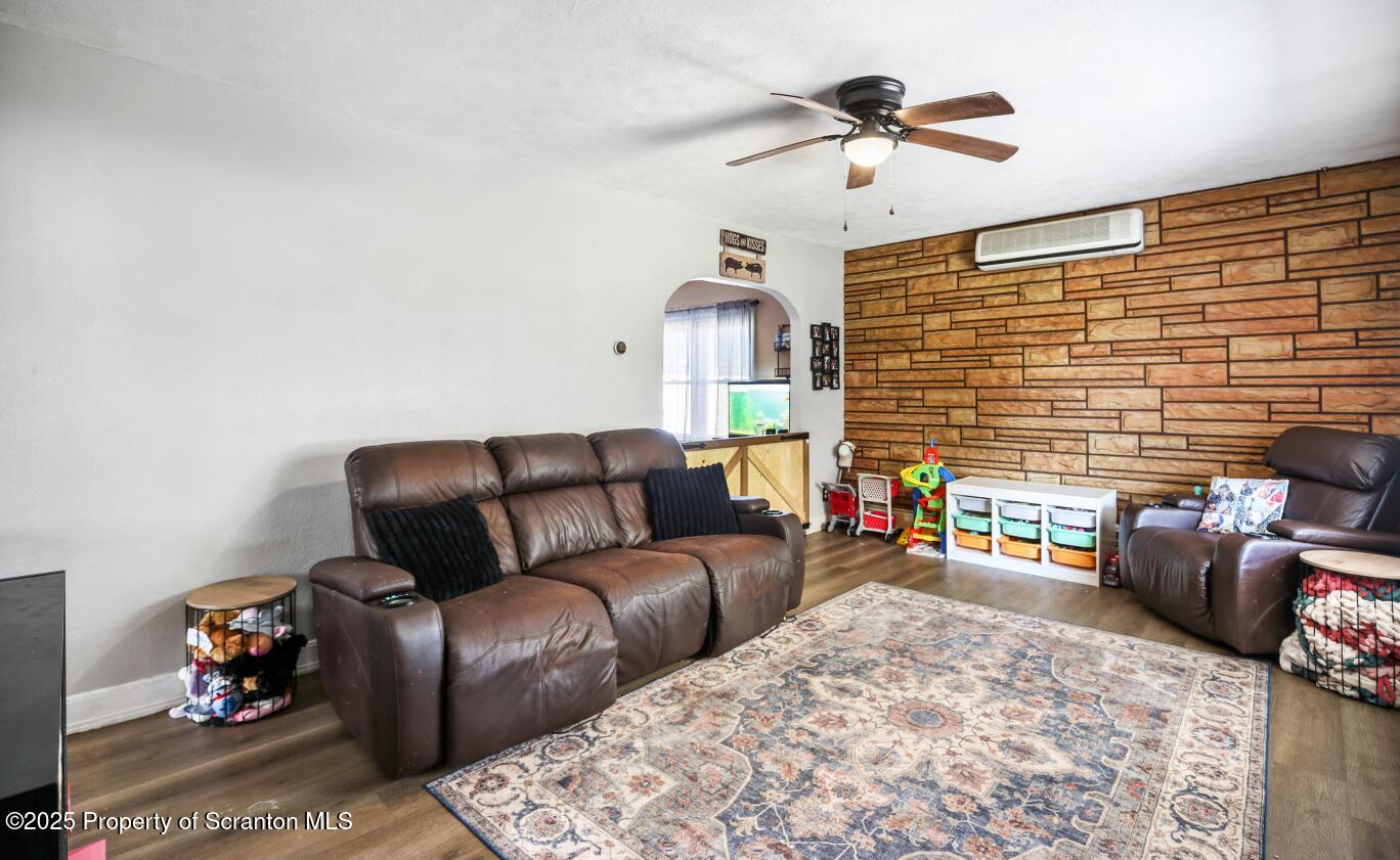 7840 Blue Ridge Trail Mountain Top, PA 18707 - Photo 8 of 20 a living room with furniture and a chandelier