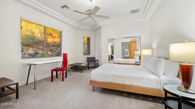 a bedroom with a bed and a table