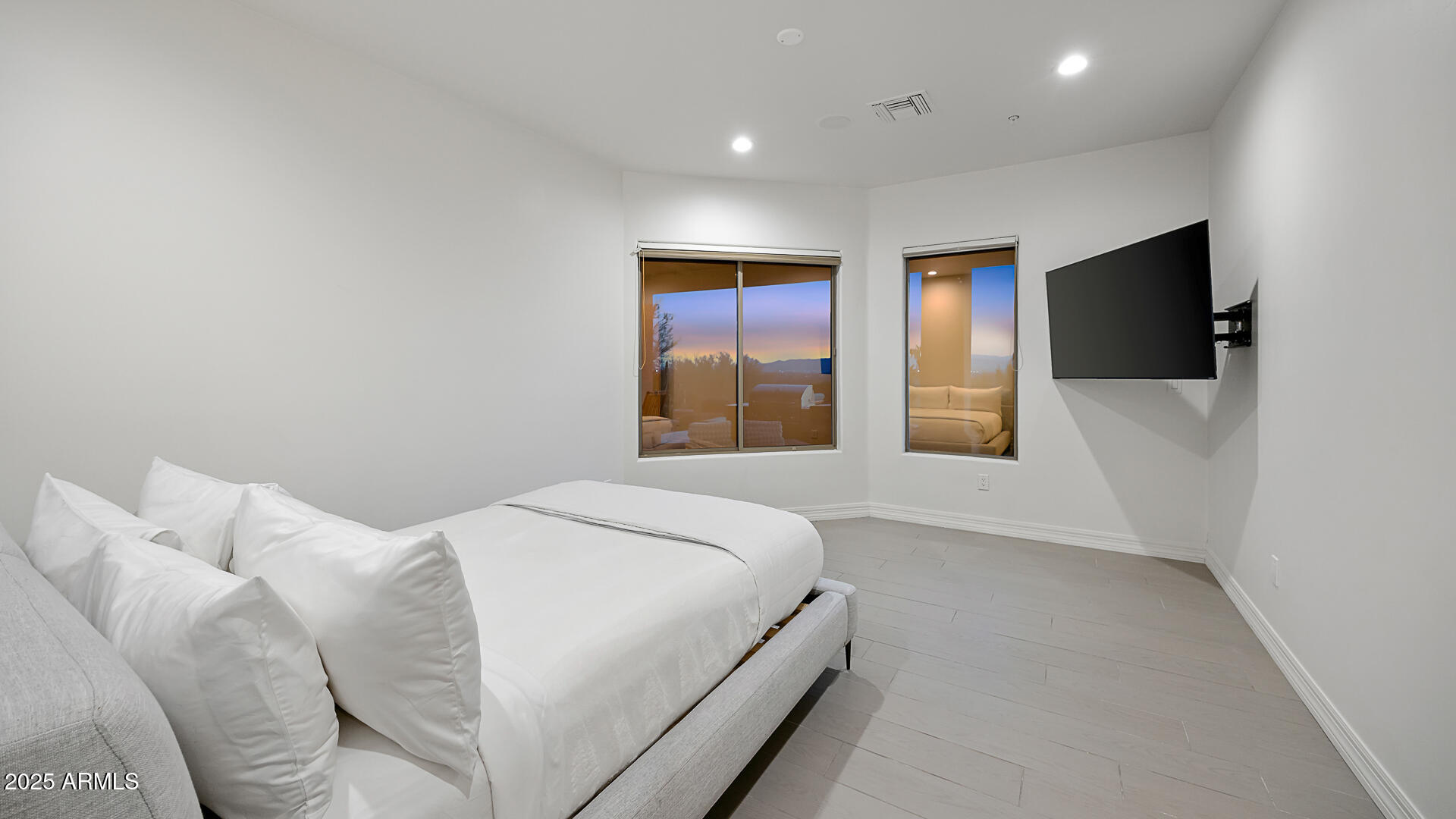 5316 East Valle Vista Road Phoenix, AZ 85018 - Photo 21 of 21 a bedroom with a bed and a flat screen tv