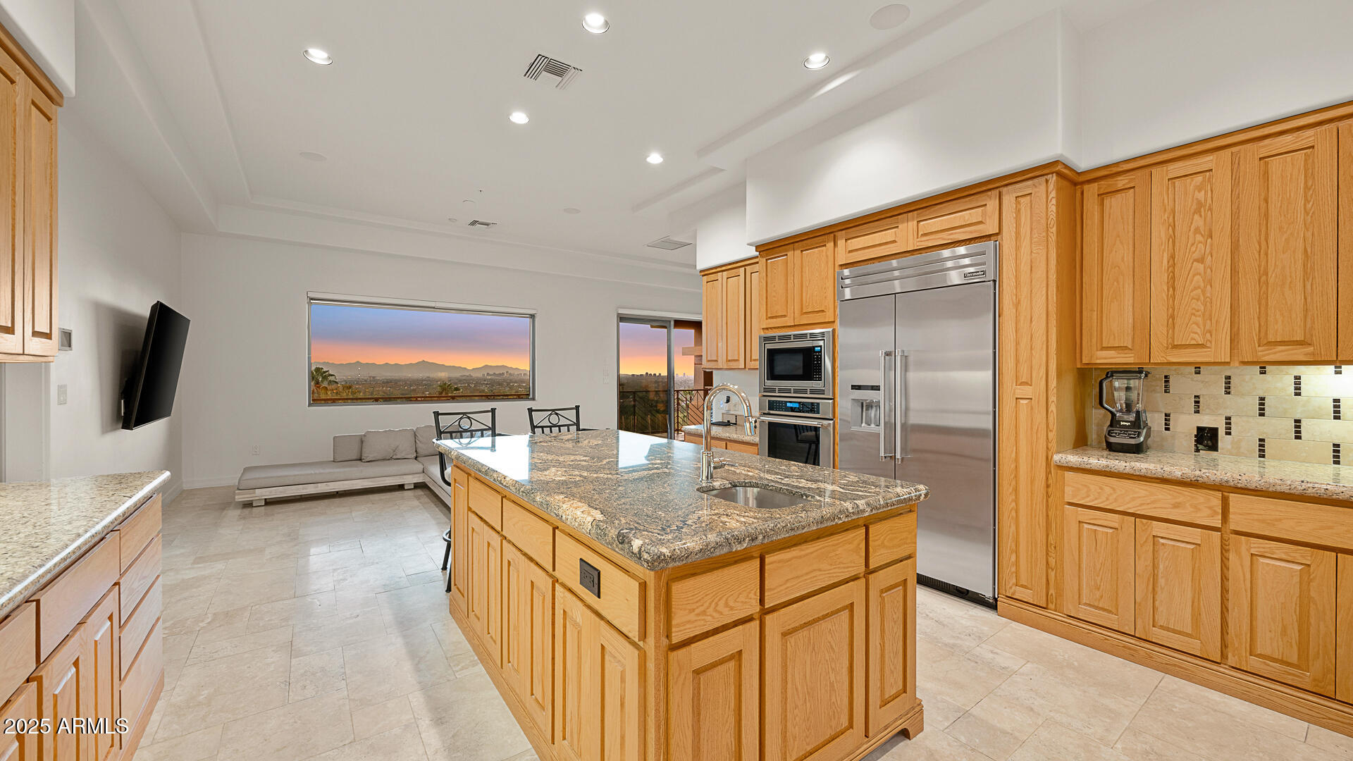 5316 East Valle Vista Road Phoenix, AZ 85018 - Photo 8 of 21 a kitchen with stainless steel appliances granite countertop a sink and a refrigerator