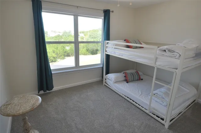 a room with a bed and a window