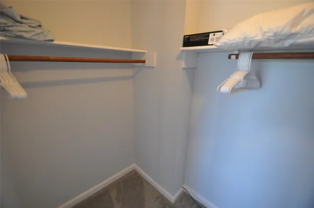 a bathroom with a window and vanity