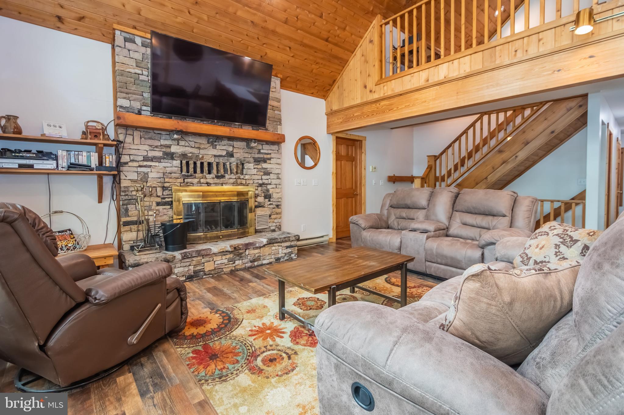 1140 Rock Lodge Road McHenry, MD 21541 - Photo 3 of 60 a living room with furniture and a fireplace