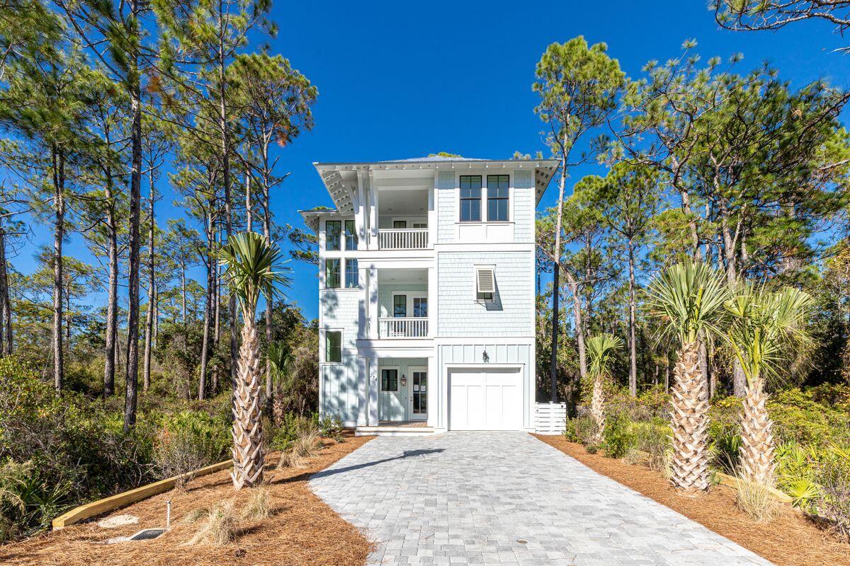 274 Redbud Ln Inlet Beach Inlet Beach, FL 32461 - Photo 1 of 25 a white building with a tree in front